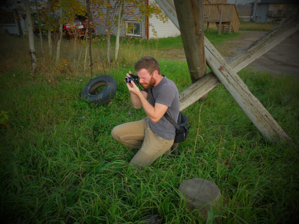 Ian Willms is seen taking a photo in Fort McKay, Alberta.