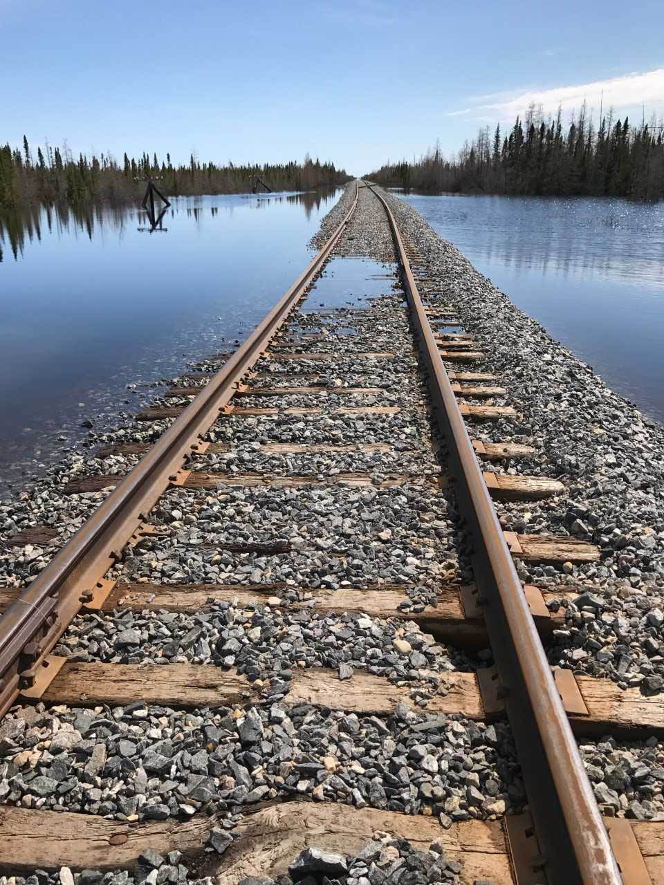 Water washes over the damaged Hudson Bay Railway near Churchill, Manitoba in 2017