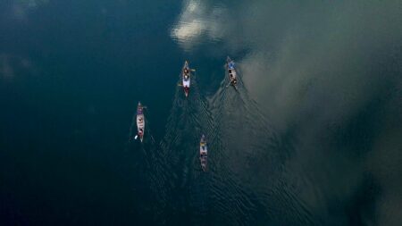 Aerial view of four canoes testing Koocanusa Reservoir selenium
