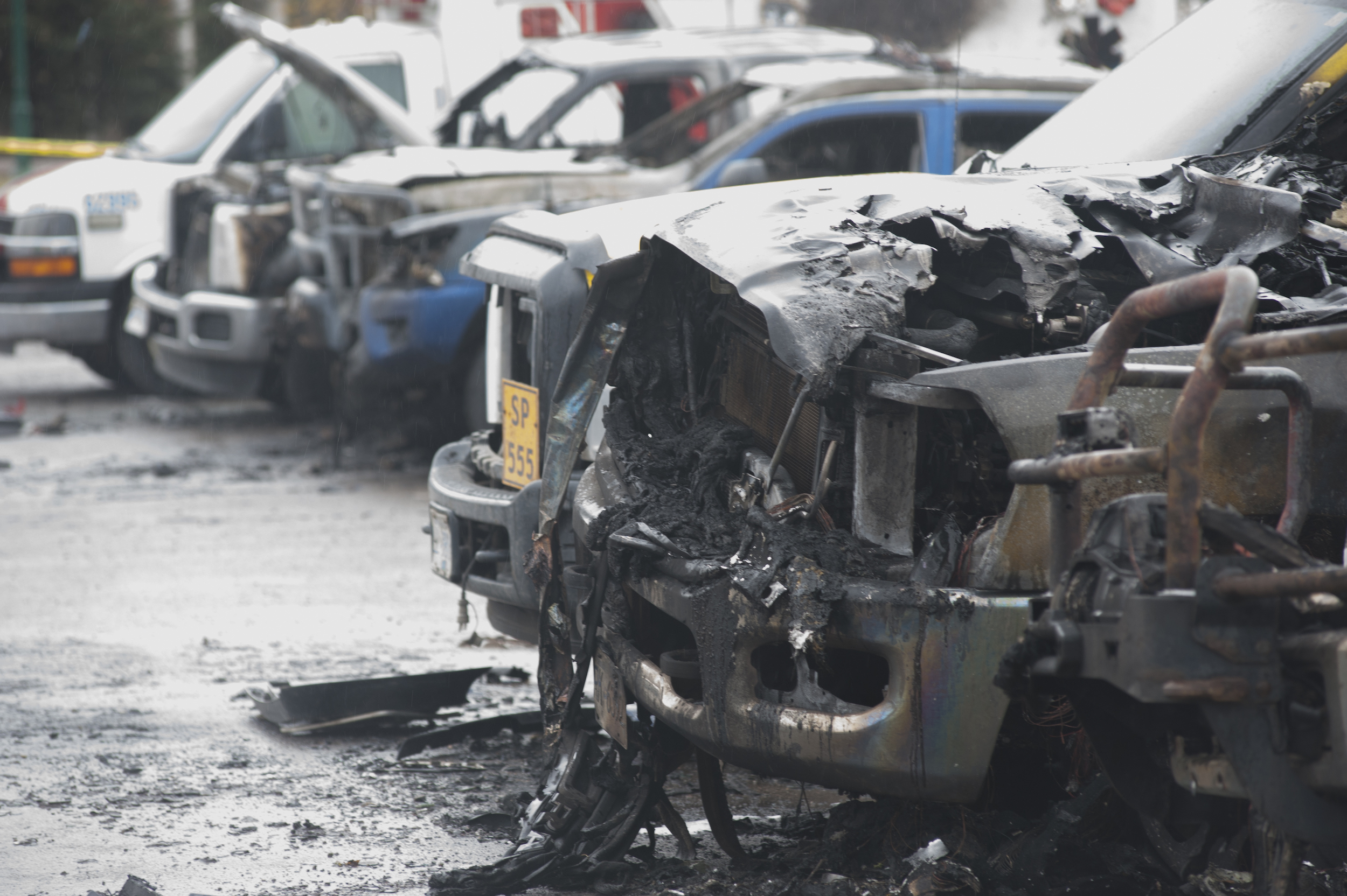 Burned vehicles sit in a Smithers, B.C. parking lot after an alleged arson on Oct. 26, 2022
