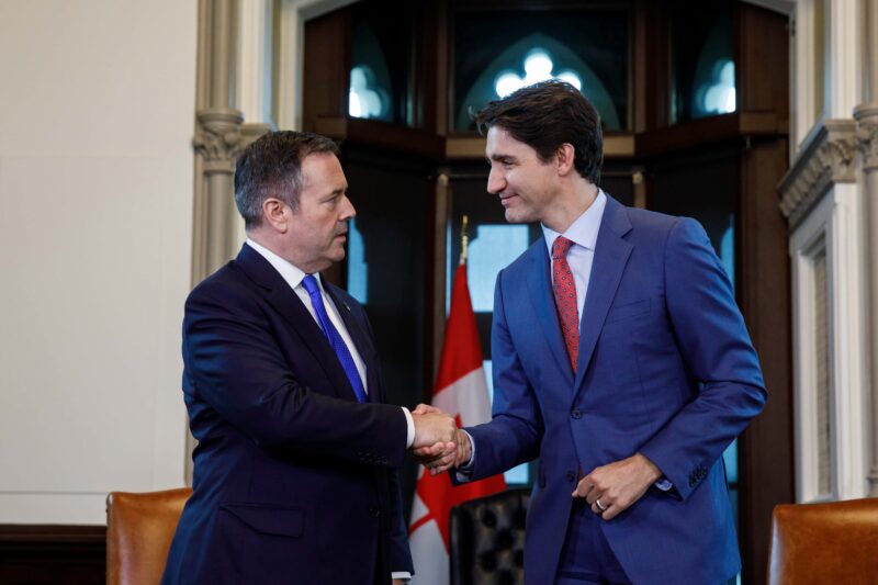 Former Alberta premier Jason Kenney shakes hands with Prime Minister Justin Trudeau
