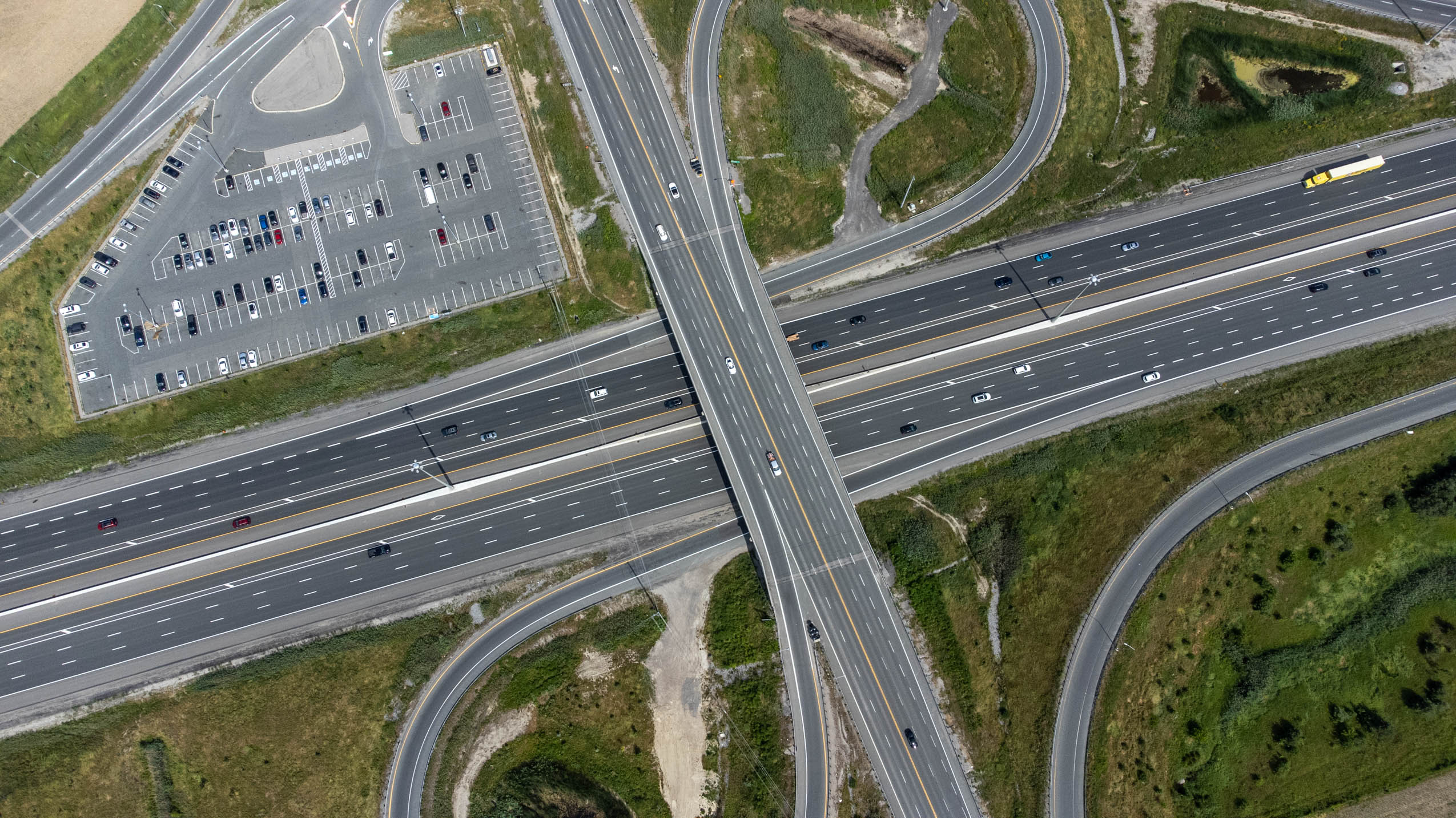 Ontario highways: A highway interchange and parking lot seen from above