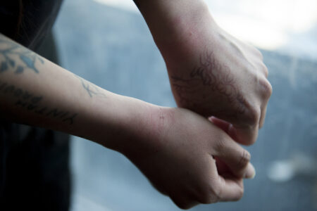 Jocey Alec, daughter of Wet'suwet'en Chief Woos, shows her wrists, marked by zip ties during her arrest