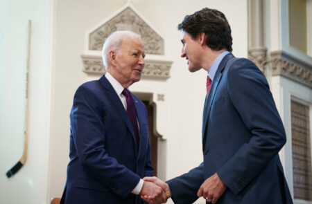 Justin Trudeau and Joe Biden shaking hands.