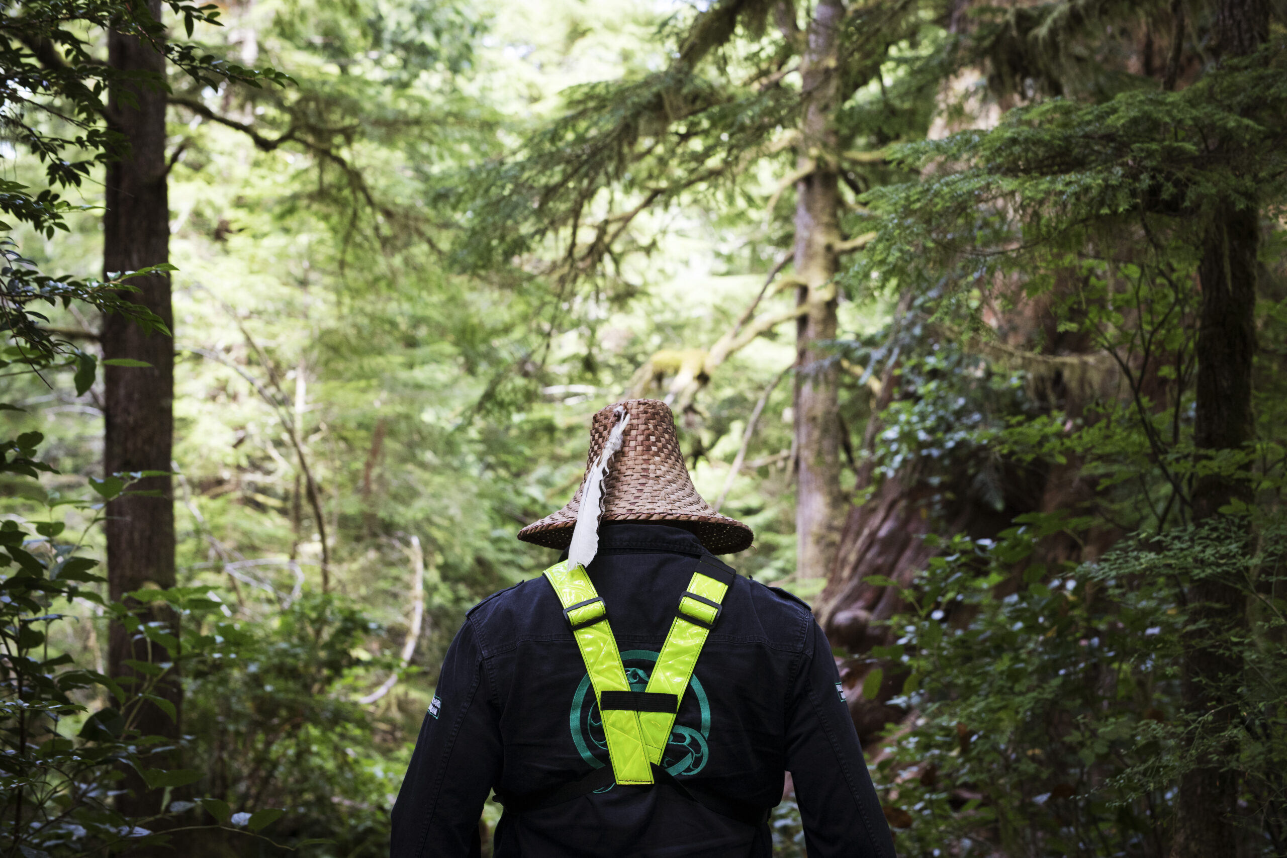 Tla-o-qui-aht First Nation Natural Resources Manager Saya Masso walks along the Big Tree Trail on Meares Island, near Tofino