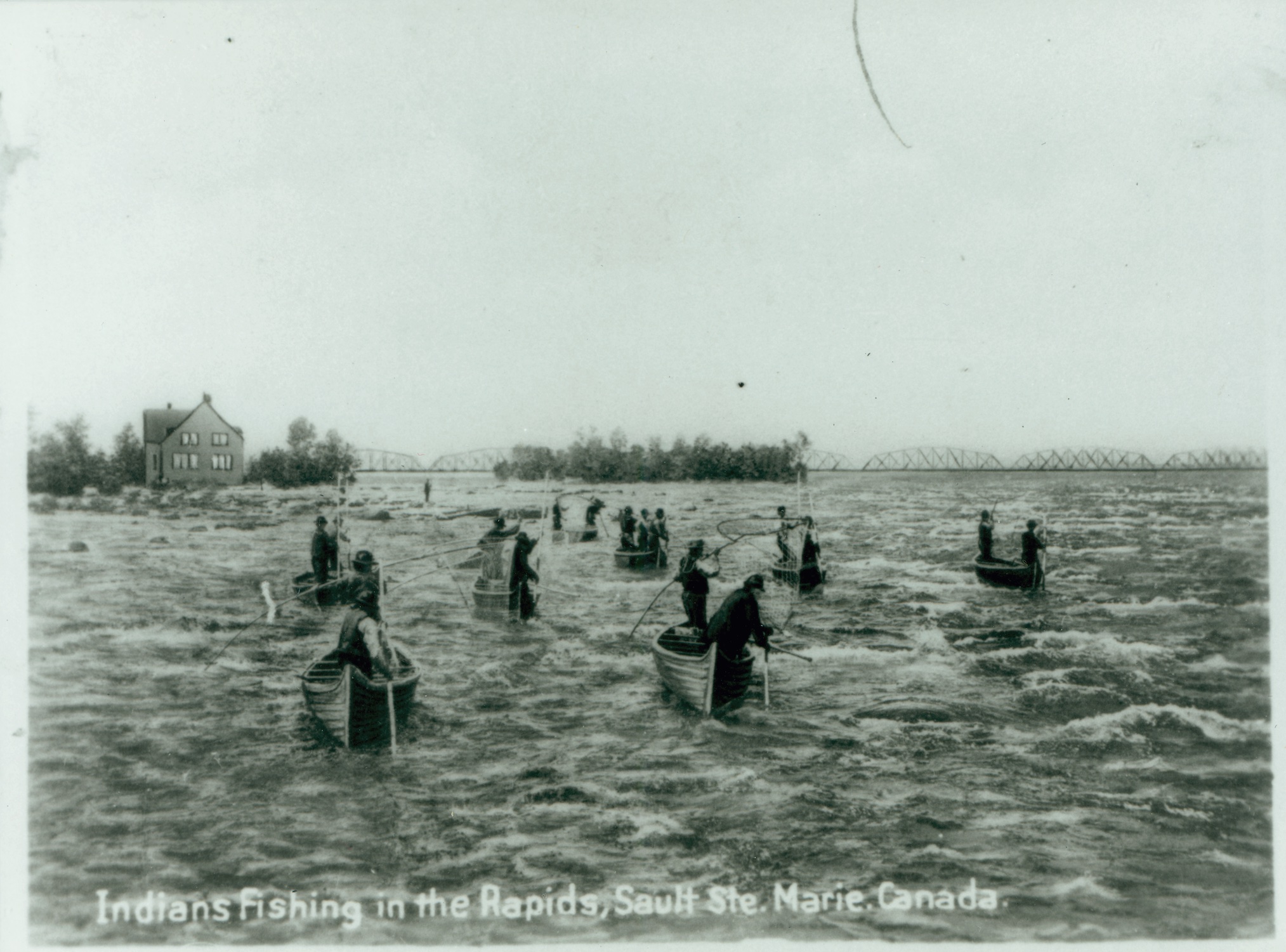 Anishinabek fishing in the St. Mary's River around 1885.