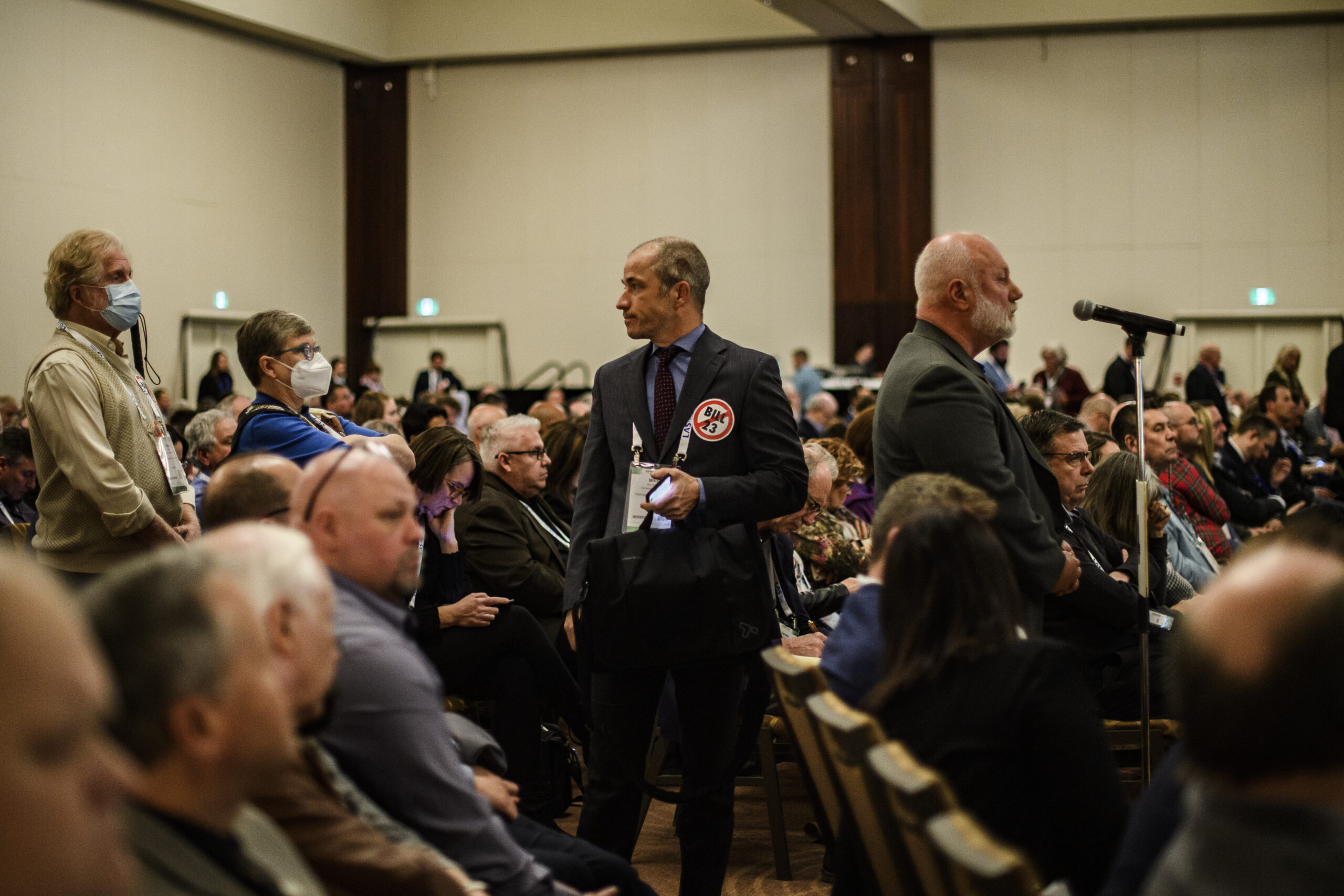 Rural municipality officials protest against Doug Ford's Bill 23 with stickers at their annual conference held in January 2023.