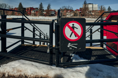 A sign warns people not to go onto the Rideau Canal in Ottawa, which did not open for skating for the first time in 50 years.