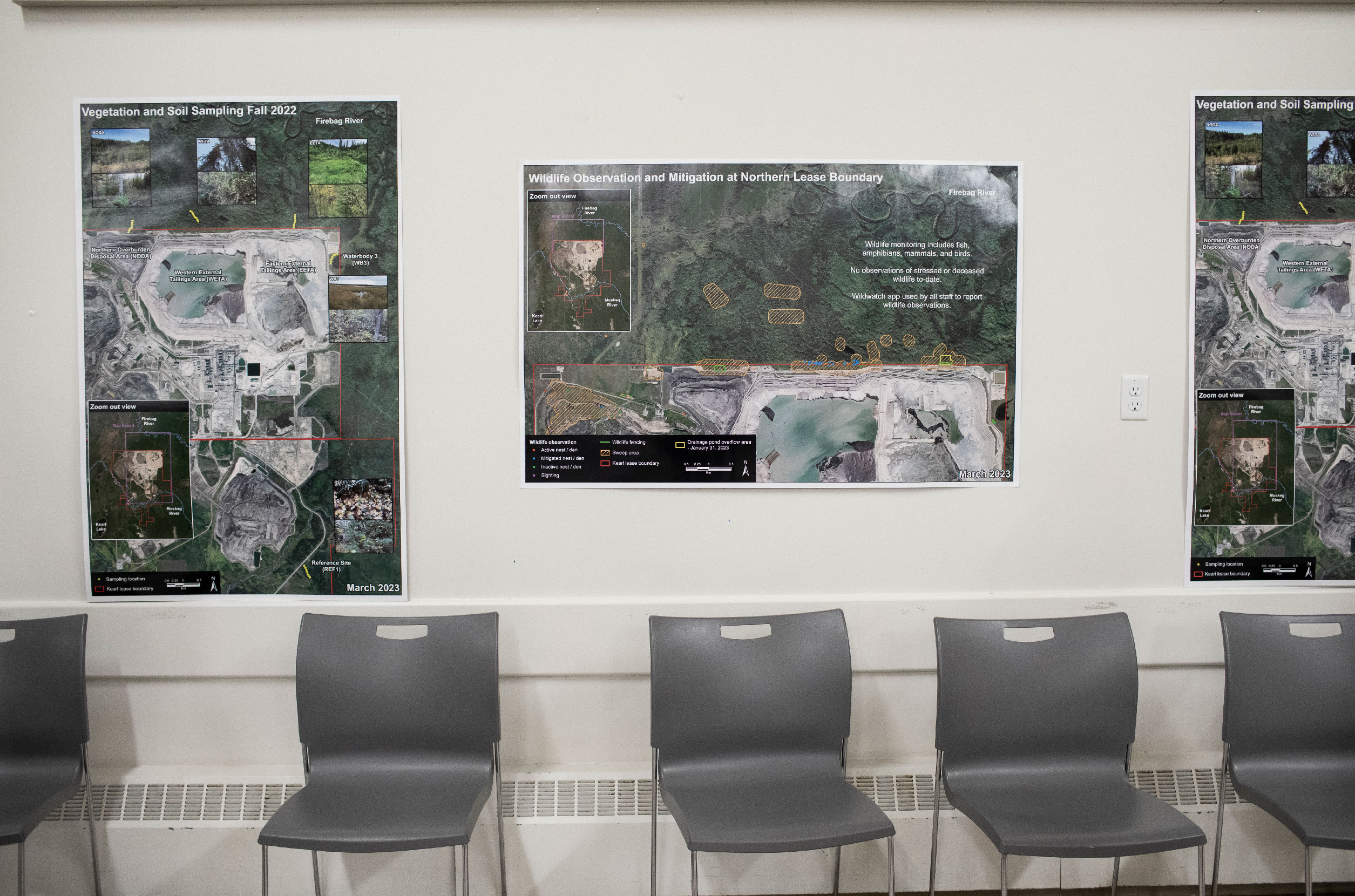 Information posters at a meeting to talk about leaking tailings ponds in Fort Chipewyan, Alta.