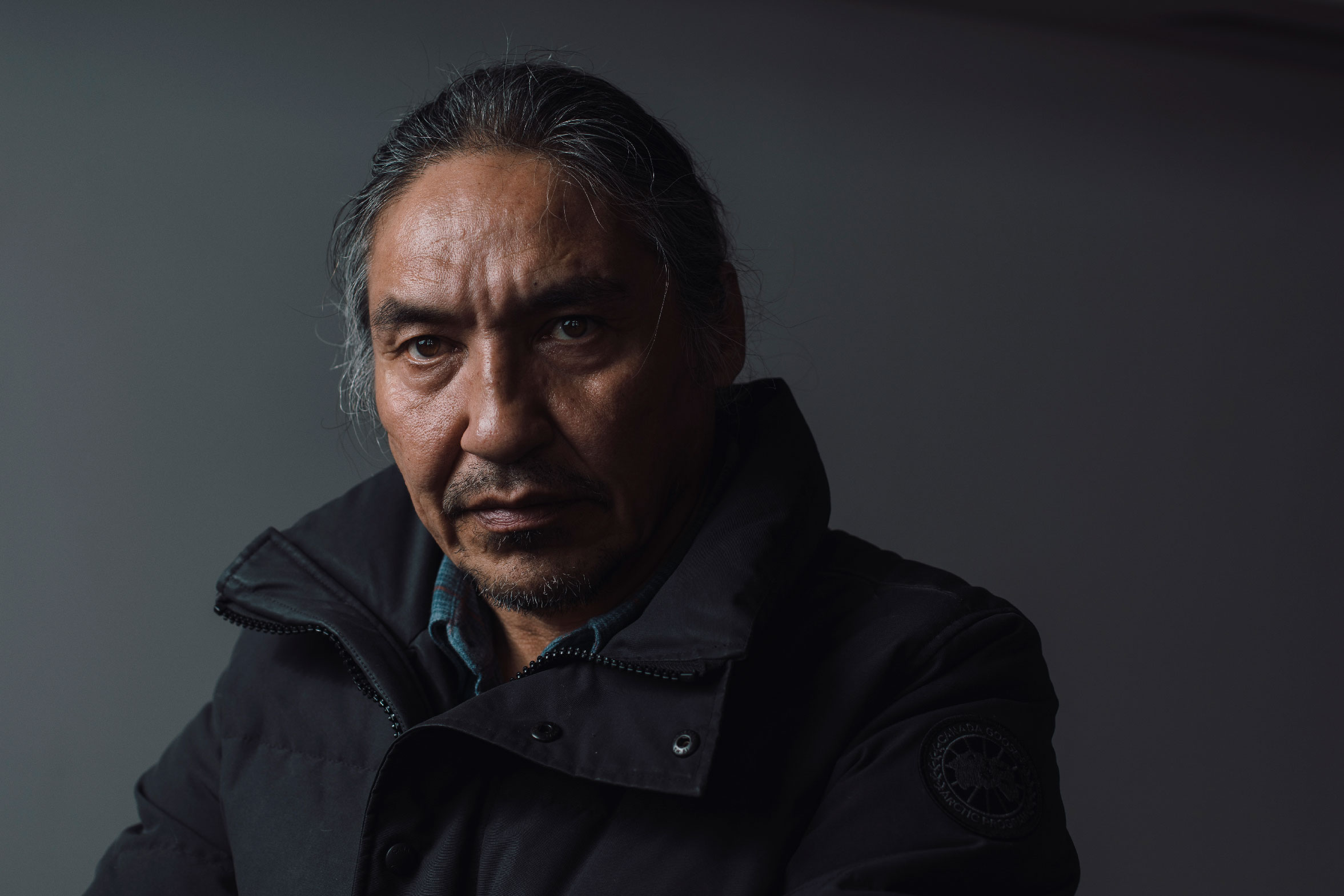 A portrait photo of Chief Allan Adam of the Athabasca Chipewyan.