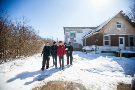 A family of five: Georgina (left), Wesley, Hunter, Callie, and Josh Mustard on their property near Anola, Man., with snow on the ground