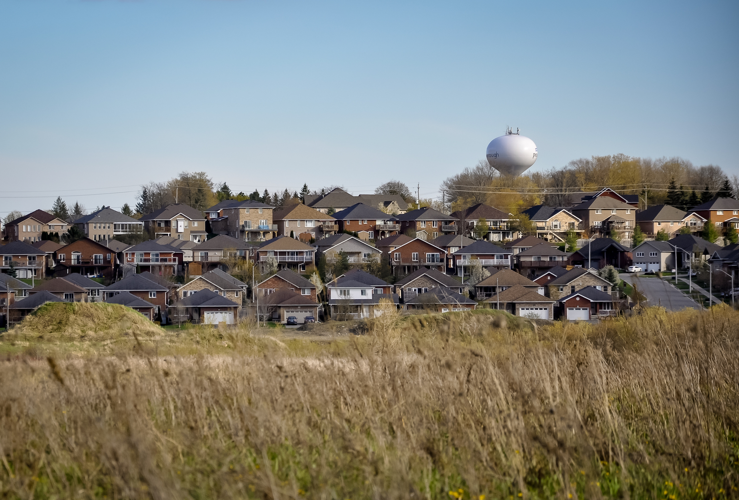 Peterborough, Ontario, Canada - May 7, 2021: View of houses and water tower in Peterborough in spring.