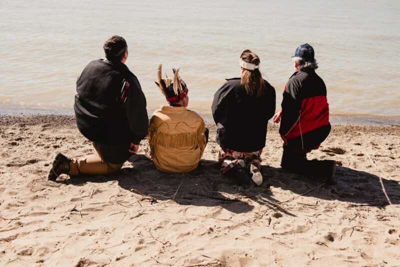 Caldwell FN Chief Mary Duckworth with members of her nation on Ojibway Shores on March 15, 2023