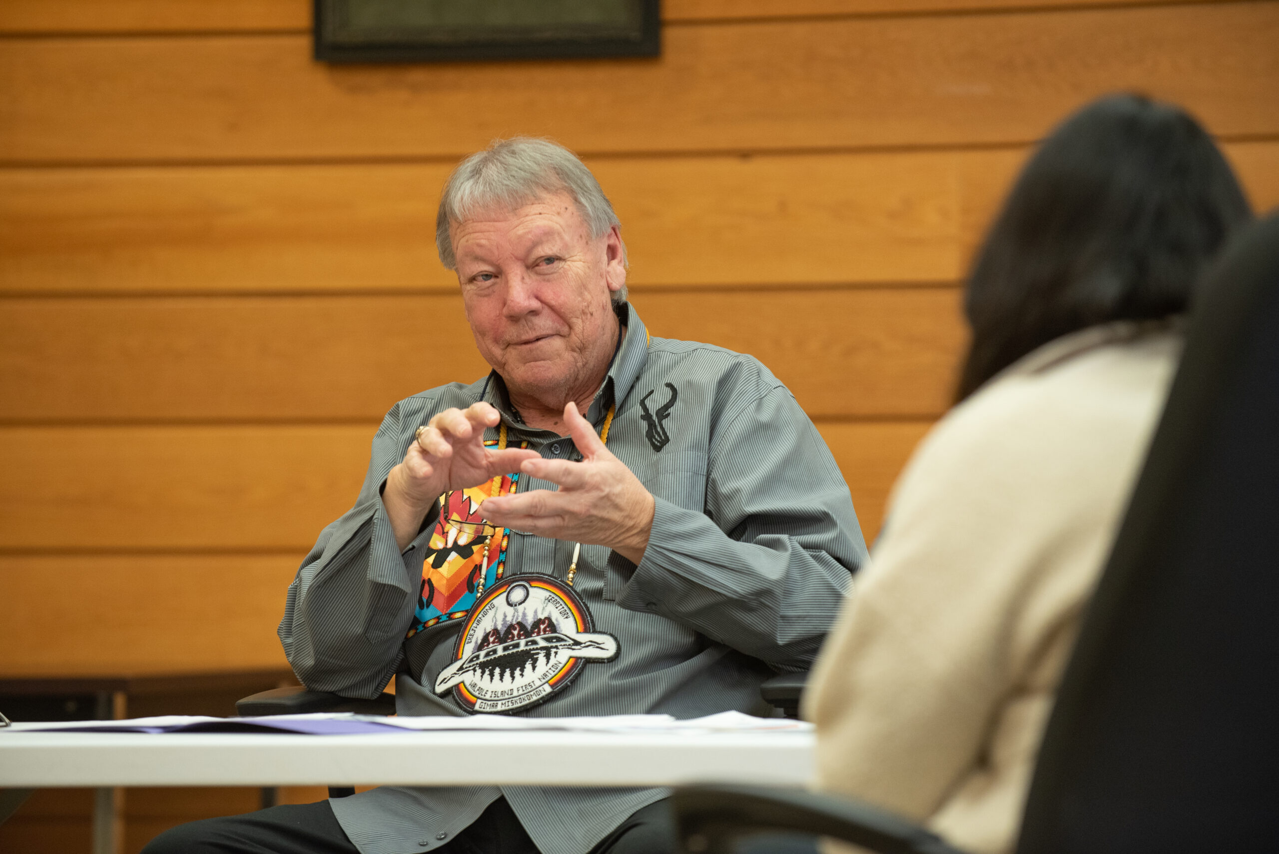 Walpole Island First Nation Chief Dan Miskokomon sitting and talking.