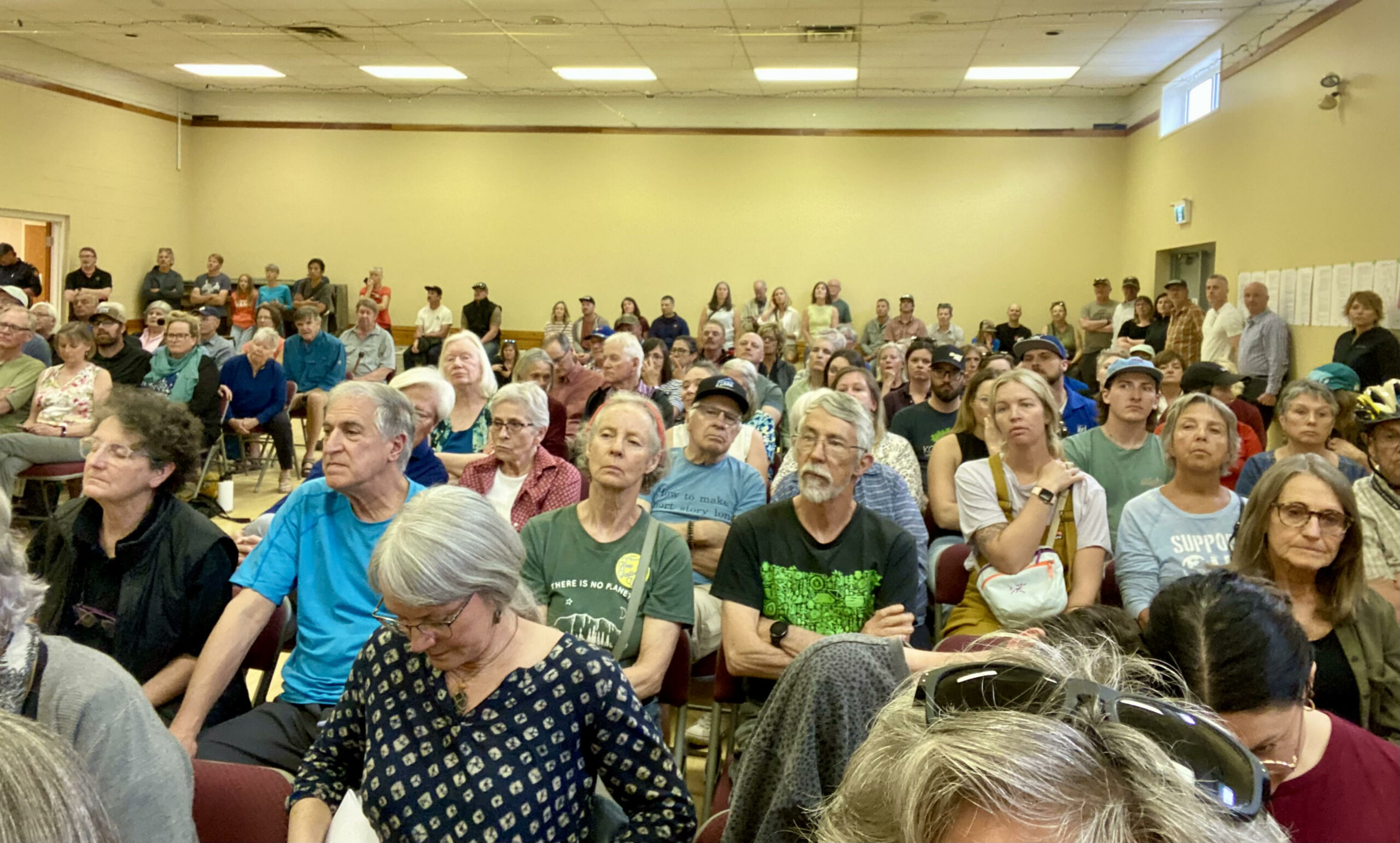A photo of people at the public hearing