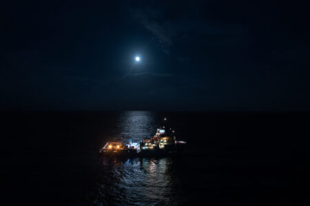 Deep-sea mining vessel in moonlight on dark water; The Metals Company