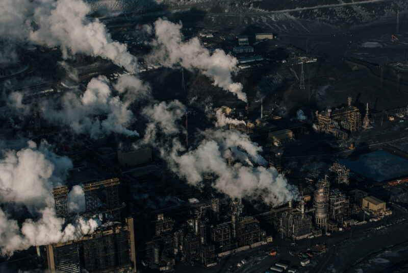 Plumes rise above large-scale plants at the Suncor Base Plant in Alberta's oilsands