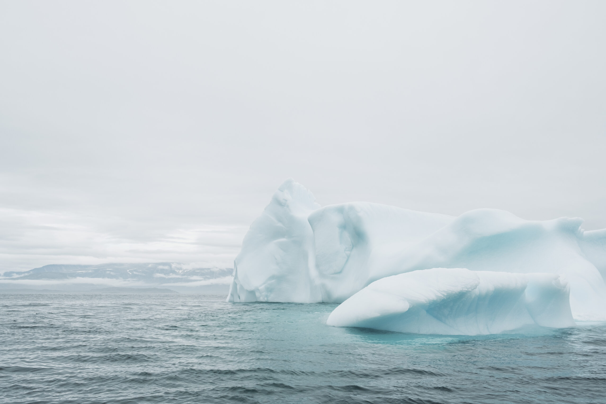 Bright white and blue iceberg on the waters of the Labrador Sea.