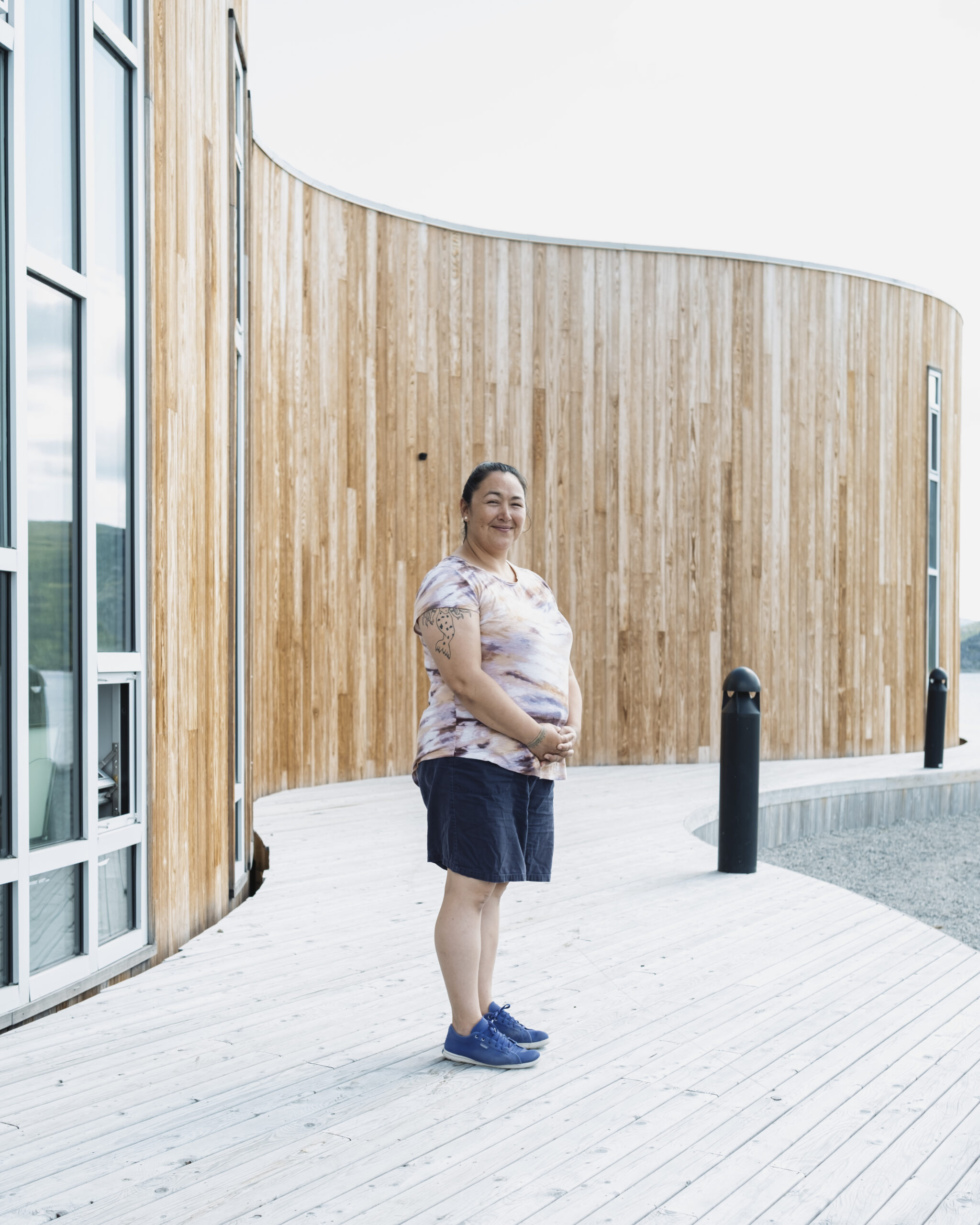 Lena Onalik, an archaeologist with the Nunatsiavut government, stands next to the cultural centre in Nain, Labrador.