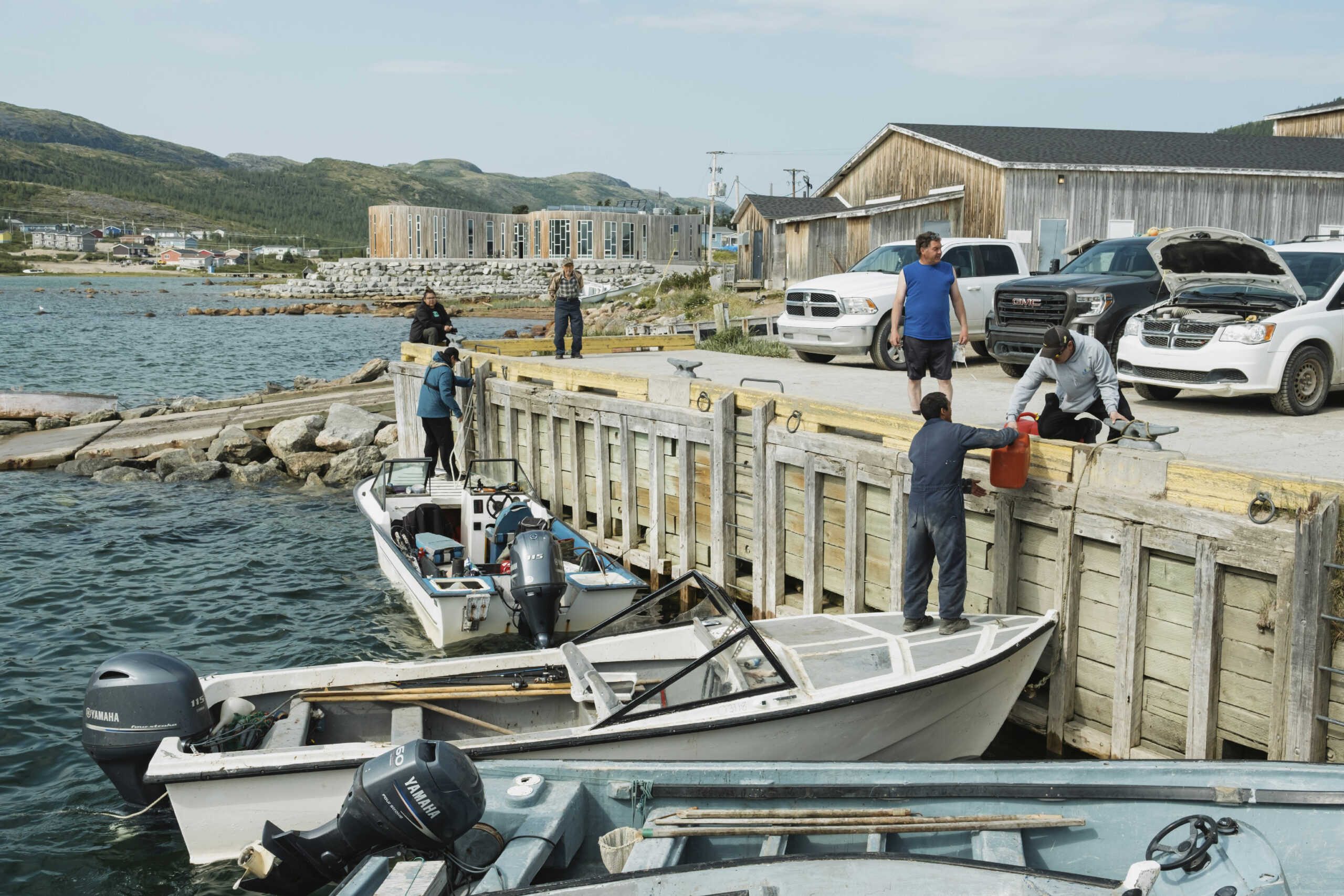 People load their boats before going out on the water at the dock in Nain, Labrador.