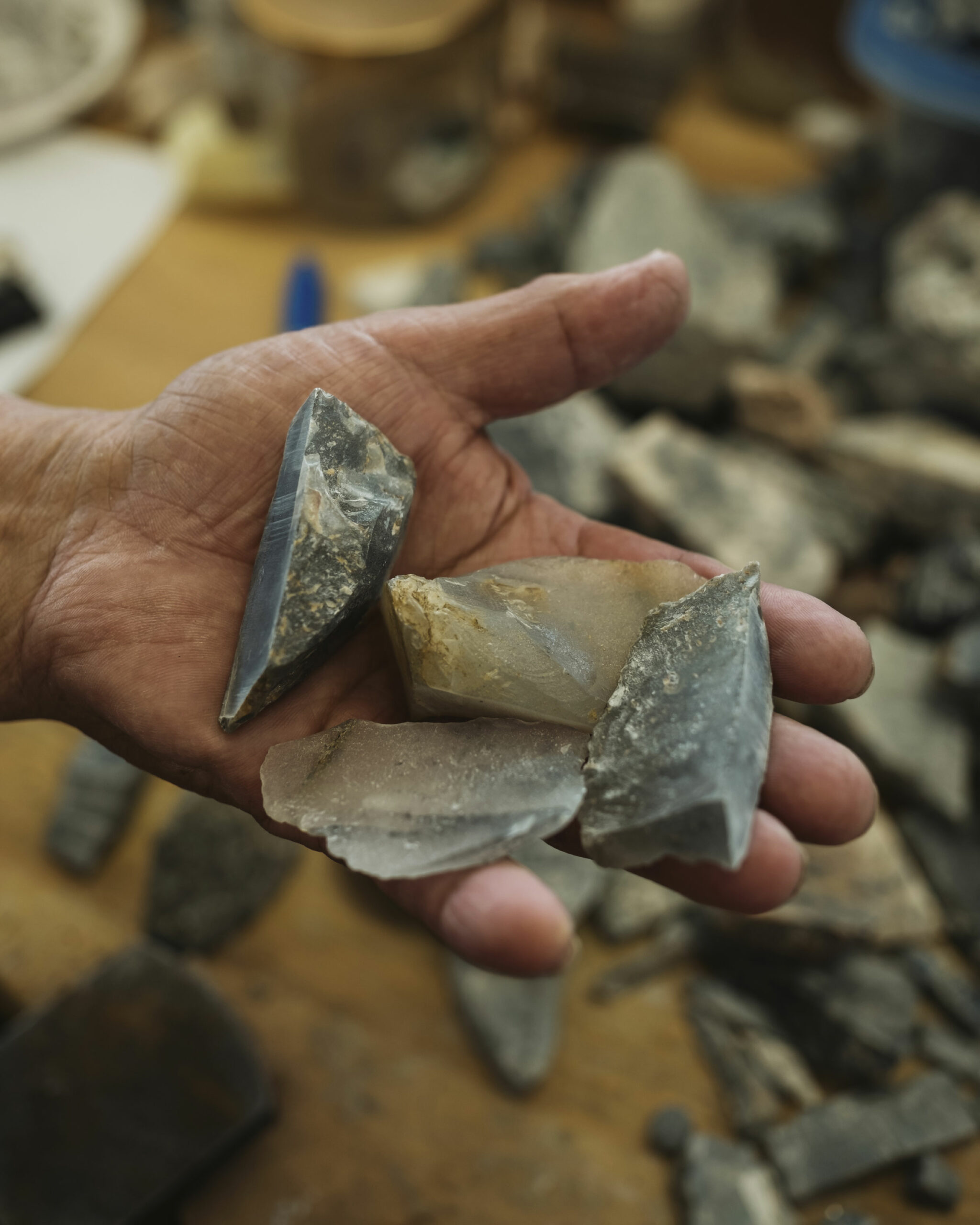 Lukas John Terriaka, a carver and jewelry maker, holds a small batch of Ramah chert — a semi-translucent stone found north of Nain, Labrador.