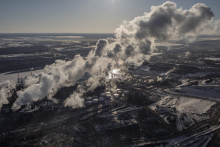 Emissions will be front and centre at COP28. Here, an aerial view of steam emissions rising from an industrial facility in the Alberta oilsands
