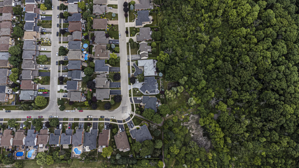 Ontario Greenbelt: a suburban neighbourhood seen from above, bordering on forest