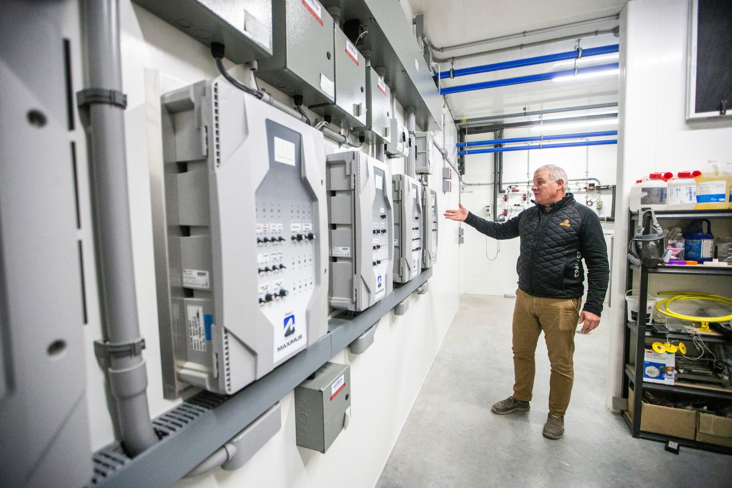 Kurt Siemens gestures to a wall of grey panels that control ventilation and other aspects of his Rosenort, Manitoba egg farm