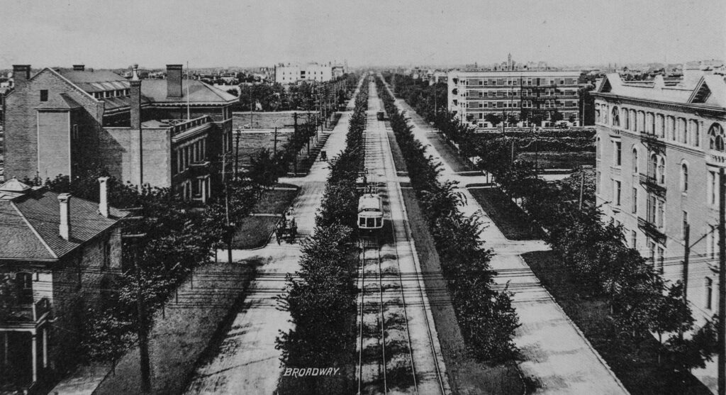 Aerial view of Winnipeg's Broadway Avenue showing a streetcar on the tracks running down the centre of the roadway in 1910