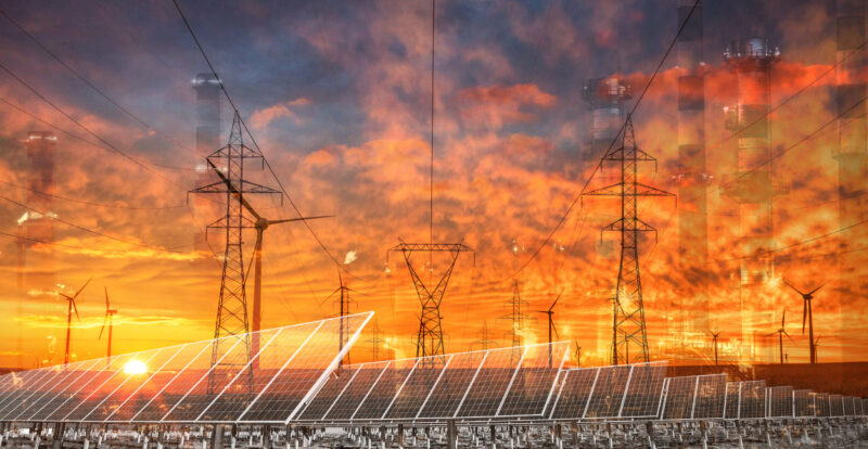 Electricity grid illustration showing power lines in front of prairie sky, with stacks and solar panels visible in silhouette