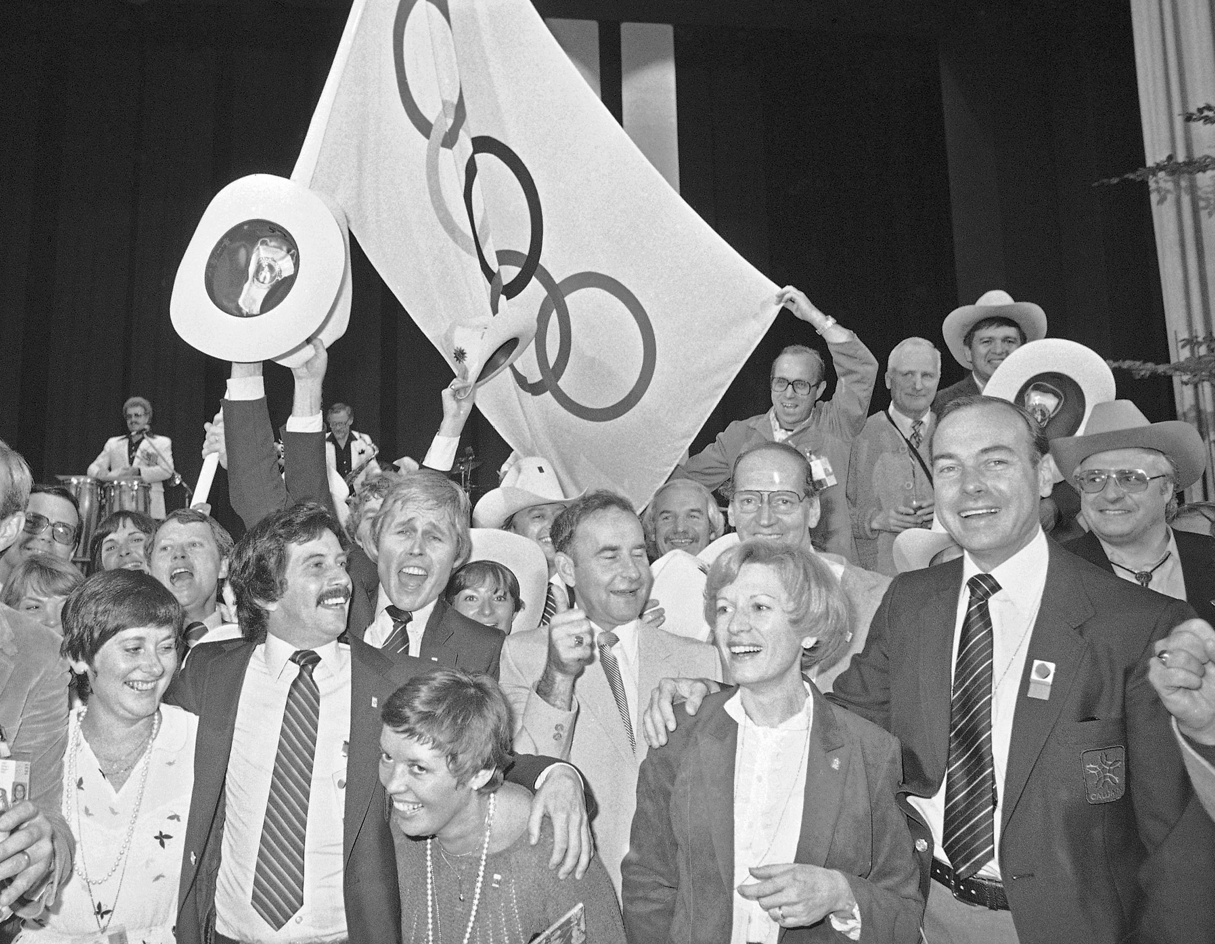 Organizers of Calgary's winter Olympics bid celebrate in Germany after being awarded the games in 1981