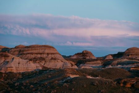 Pink-hued clouds over the Alberta badlands