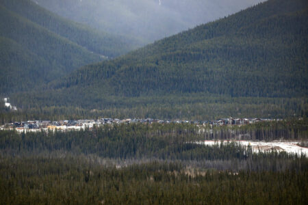 A strip of homes, part of an earlier development, sits on the Three Sisters lands in Canmore