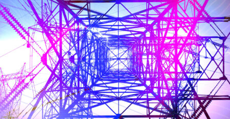 A transmission tower is pictured from a perspective directly underneath it, looking up. The colours are altered such that the tower appears in a geometric pattern in a gradient o blue, purple and pink.