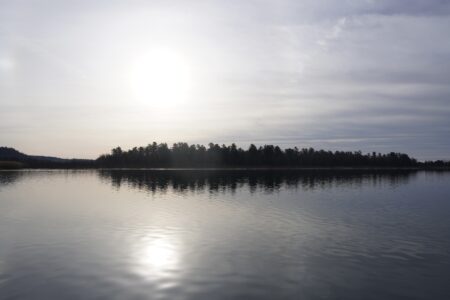 A shot of Squirrel Island on the St. Mary's River, the sun shining through hazy clouds.