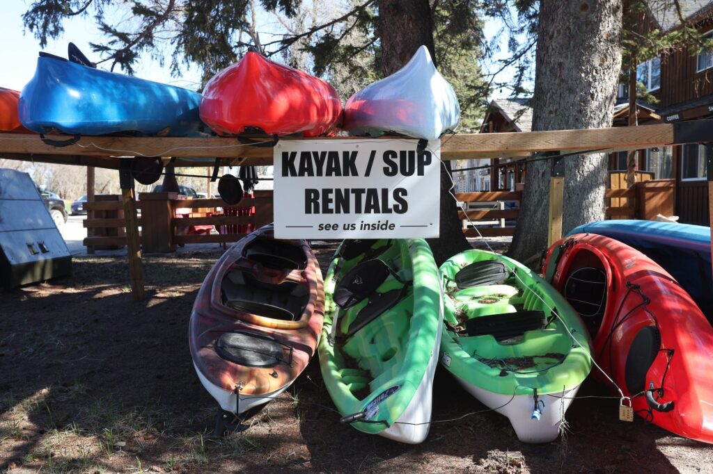 Riding Mountain National Park: A row of kayaks for rent at Cycle Creek Outdoor Supply in Wasagaming