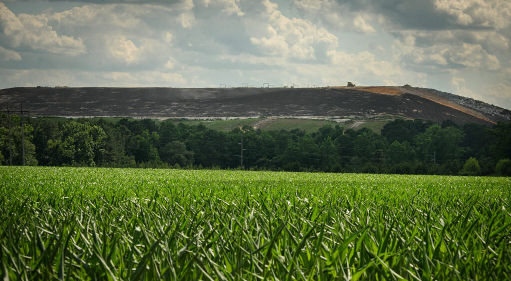 The Sampson County landfill rises high above a cornfield near Roseboro, N.C.