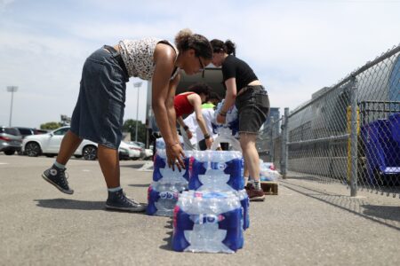 Volunteers with Project Food Chain drop off water at the St. Felix 24-hour respite site in Toronto, as a June 2024 heatwave blanketed areas of Ontario.