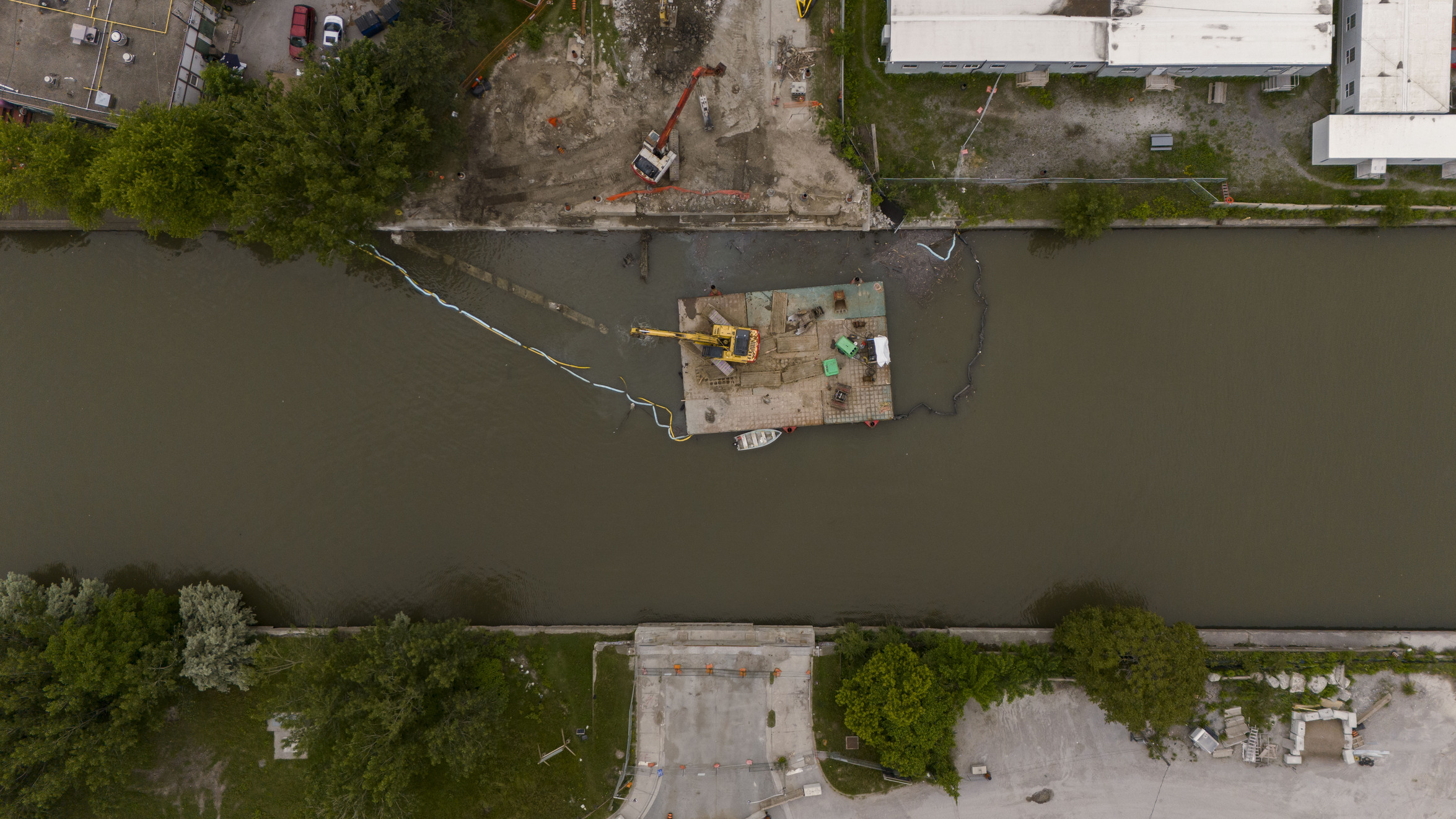 Green* Economy: an aerial view of construction equipment on the Keating Channel.