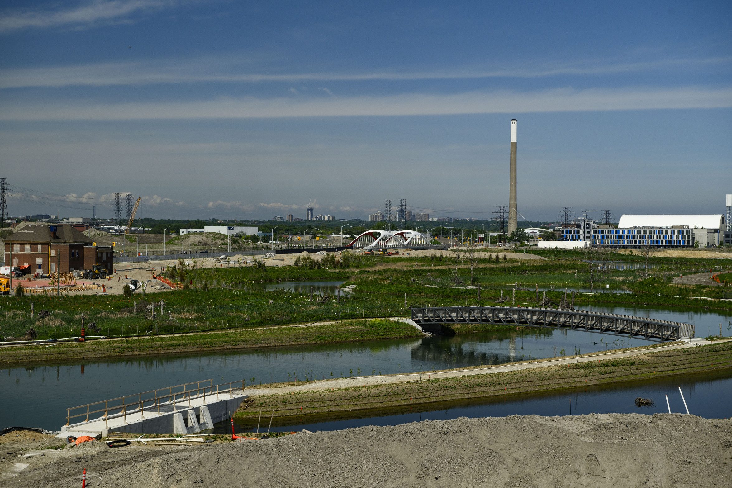 Green* Economy: lush greenery and two new bridges being installed in the revitalized Port Lands in downtown Toronto