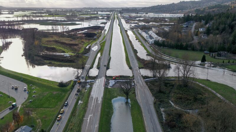 Sumas Lake: A partially flooded BC Highway 1 stretches through a flat, watery landscape