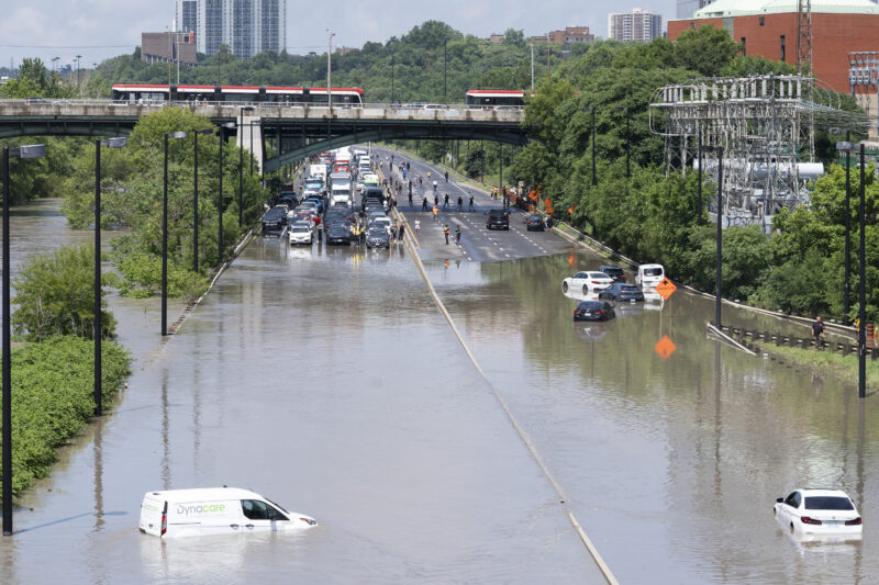 Cars were partially submerged in flood waters in Toronto's Don Valley Parkway