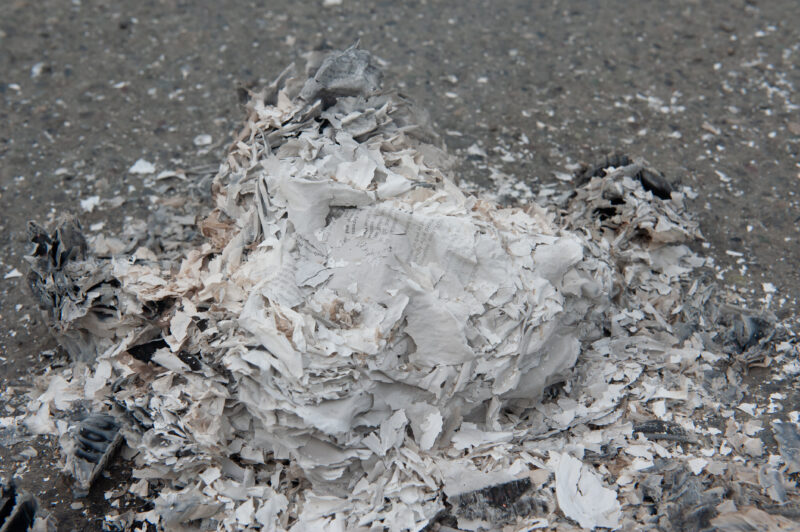 A pile of ashes after Gitanyow chiefs and supporters burned a pipeline benefits agreement