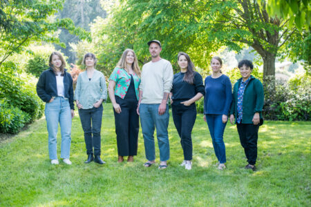 The Narwhal's Steph Kwetásel’wet Wood, Sarah Cox, Lindsay Sample, Matt Wood, Carol Linnitt, Ainslie Cruickshank and Francesca Fionda pose for a photo in B.C. in spring 2023.