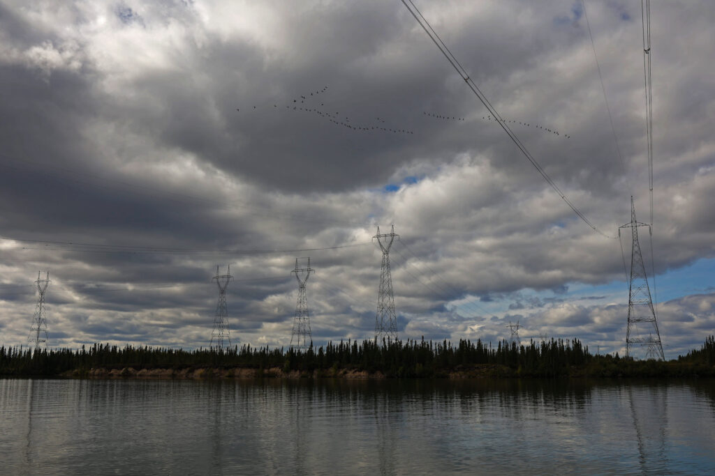 Manitoba Hydro transmission towers cross the Nelson River on a cloudy day