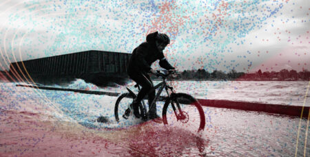 an illustration of a solitary cyclist riding through water during flooding