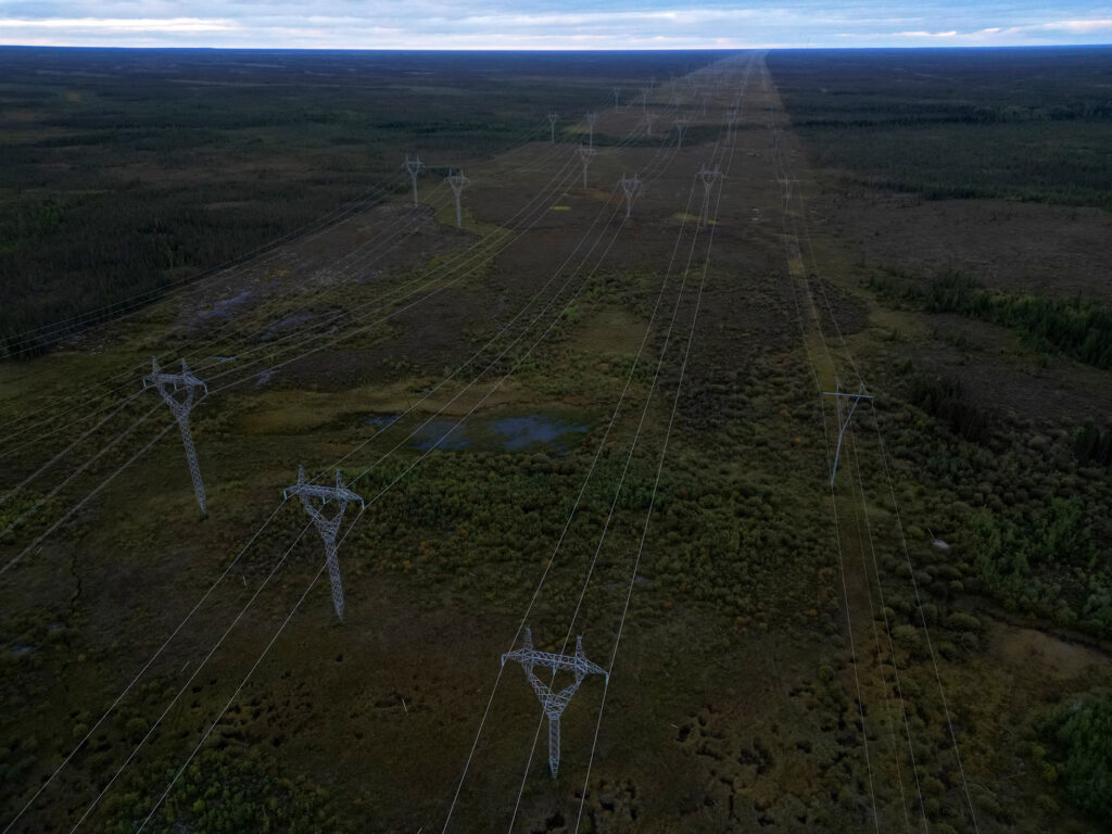 Manitoba Hydro lines run along a wide swath of cleared forest