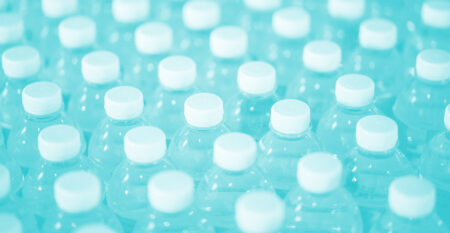 A close up of rows and rows of plastic water bottles