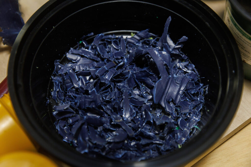 Shards of blue plastic in a bowl