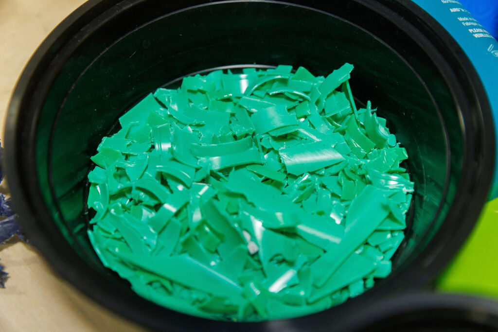 Shards of green plastic in a bowl